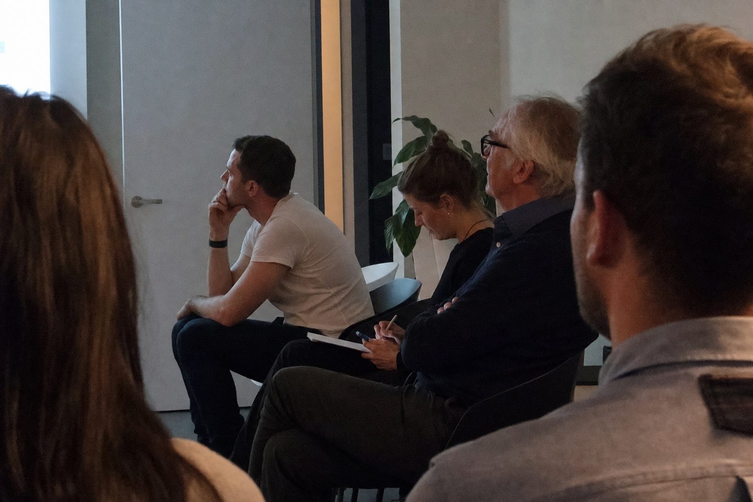 The audience, listening (illustrative)