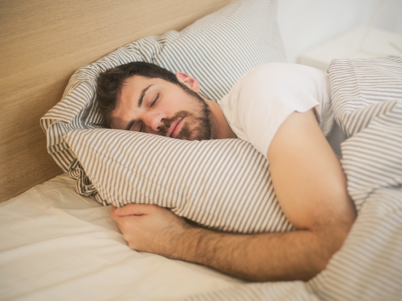 man sleeping after hair transplant procedure